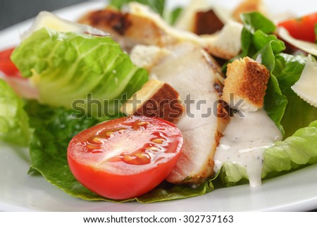 caesar salad with chicken romain and croutons, closeup photo