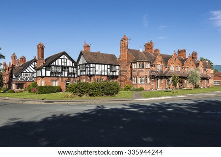 PORT SUNLIGHT, MERSEYSIDE/UK - JUNE 11, 2015: Arts and crafts architecture in model village on Wirral. The village contains 900 Grade II listed buildings and was declared a Conservation Area in 1978.