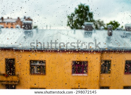 Rain, view from house window on city