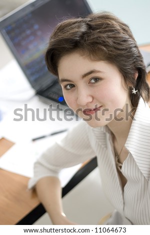 smiling young women working at office