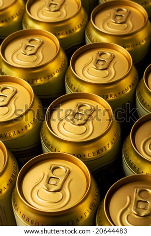 Many gold cans of beer