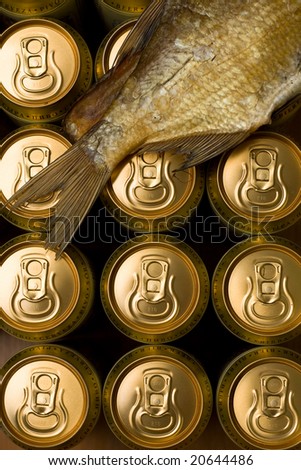 Many gold cans of beer  and fish
