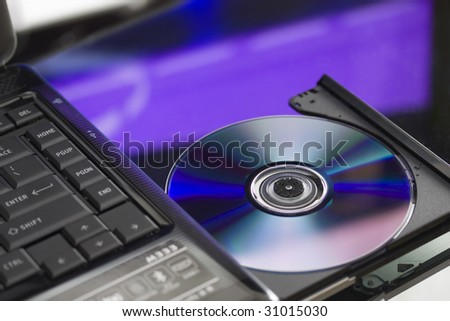 Laptop with a disk dvd.
