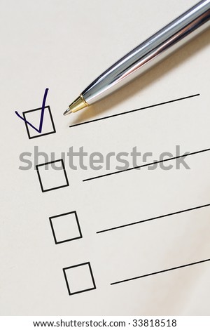 Checklist and pen.Close up.
