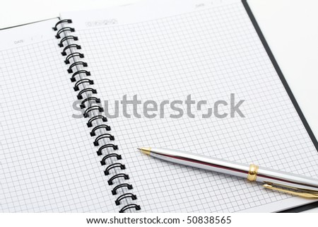 Close-up of pen and note on the table