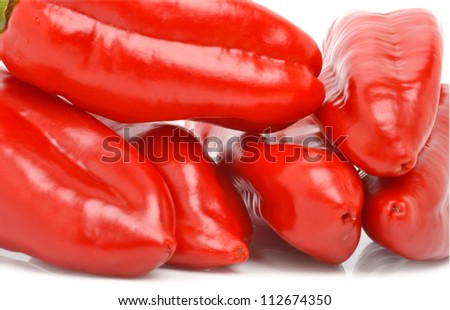 Fresh red and green bell peppers isolated on the white background