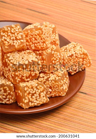 Turkish sweet delights in sesame seeds on the saucer