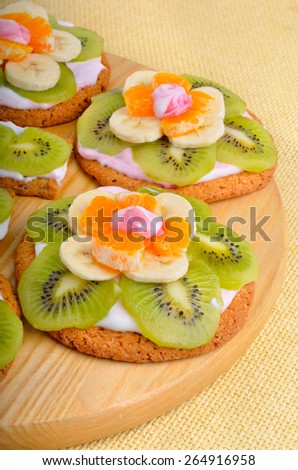 Fruit dessert with exotic fruits on a wooden background