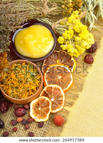 Ã�Â¡alendula flower, oats, immortelle flower, tansy herb, honey, wild rose, dried lemon on sacking background