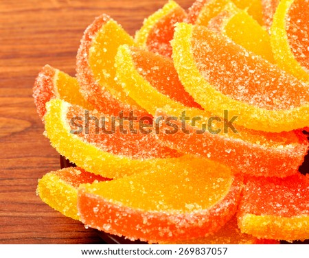 candied lemon, candied orange, candied fruit on the wooden board