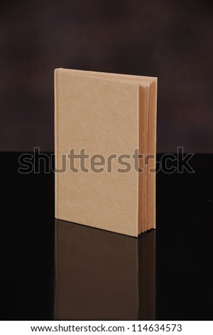 recycle brown book cover isolated on black background