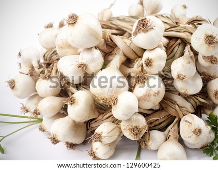 Garlic with green parsley leaves