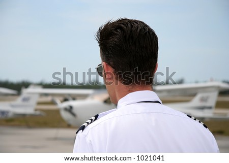 back of a pilot looking at the aircrafts on the airport