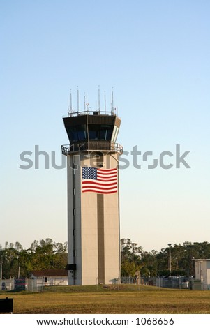 airport tower with the american flag painted on it - how patriotic