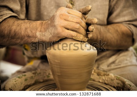 Potter works. Crockery creation process in pottery on potters\' wheel. Video footage also available.