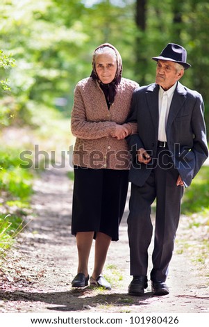 Senior couple walking outdoor in the park