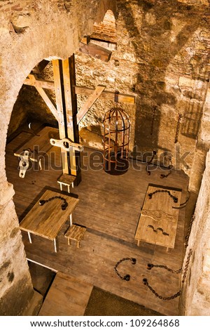 Holding Cell In A Medieval Prison, With Torture Instruments Stock Photo 