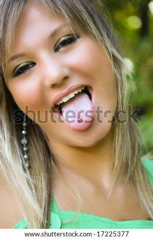 Portrait of a beautiful blonde woman with piercing