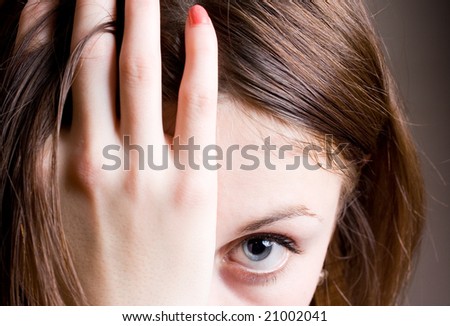 Young woman with one hand in hair