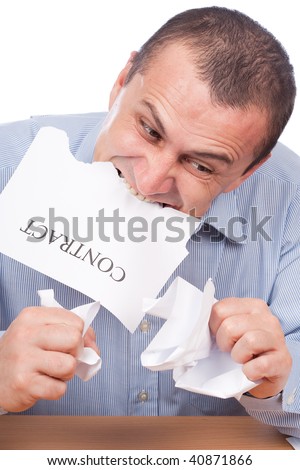 Mad businessman tearing apart a contract with his teeth, isolated on white background