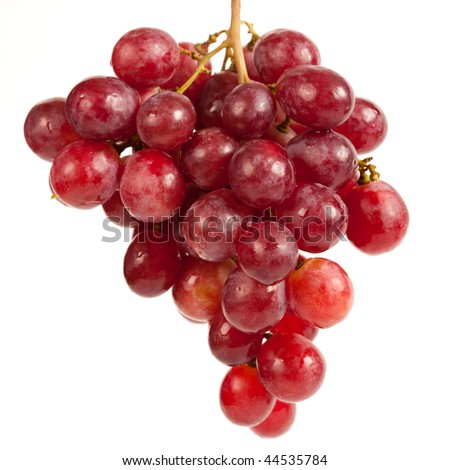 Close up of a cluster of red grapes, isolated on white background