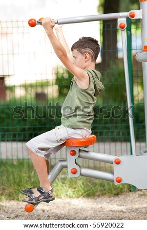 Kid with cool haircut doing fitness outdoor and having fun