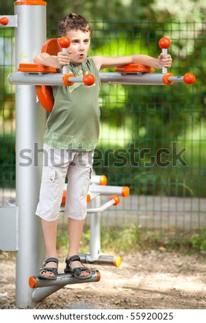 Kid with cool haircut doing fitness outdoor and having fun