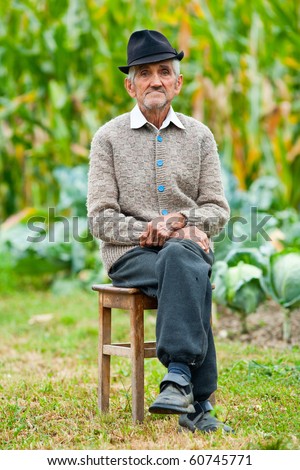Portrait of a wrinkled and expressive old farmer outdoor