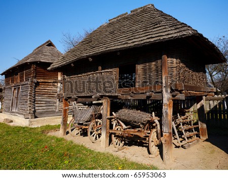 Old traditional Romanian barn or shack under blue sky - this is part of a series of images with countryside buildings in Romania