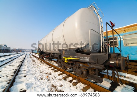 Petroleum tank on railway in a sunny winter day