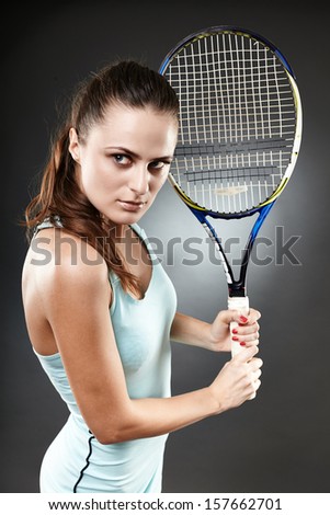 Studio shot of a female tennis player preparing to execute a backhand volley