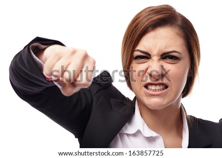 Closeup of angry businesswoman punching isolated on white background Closeup of angry businesswoman punching isolated on white background