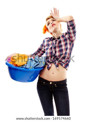 Studio shot of tired housewife holding the laundry basket, isolated over white background