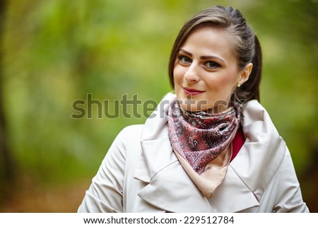 Candid closeup portrait of a beautiful woman in the forest with selective focus