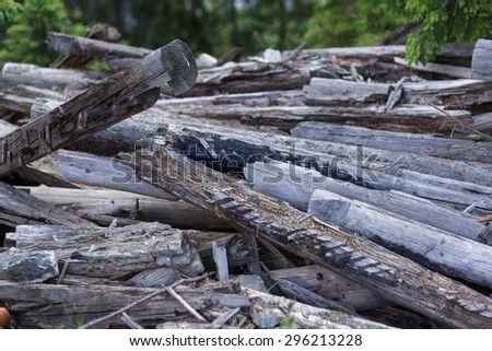 A pile of unused construction wood almost rotten
