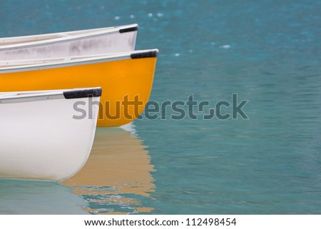 Yellow and white canoes.