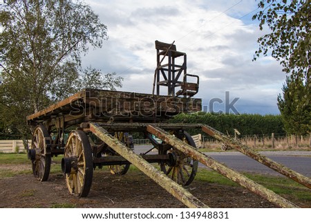 Wonderful old farm wagon sitting next to a road.