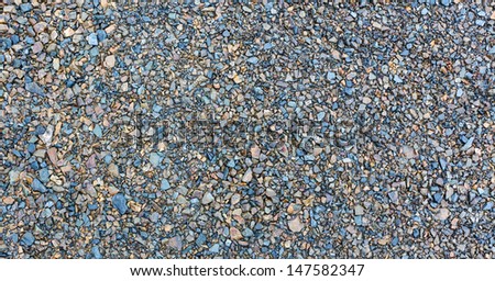 Mixed colored gravel texture, with a press in look.