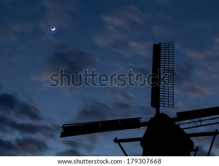 Moon out as dawn break the night sky at Foxton windmill.