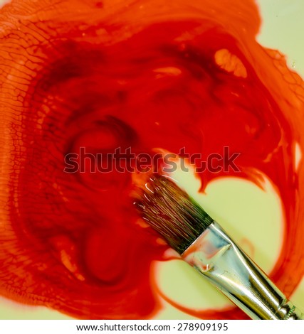 Mixture of color in this water paint and brush.