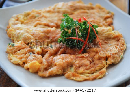 Traditional Thai omelet,simple but delicious. Thai people knows it well. The plain omelet is so good, but you can order to filling minced pork if you like.