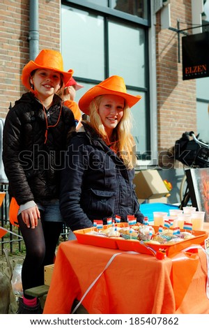 NAARDEN - APRIL 30:  Dutch annual national holiday, in the streets of the city, with unidentified children on April 30, 2013 in Naarden, The Netherlands