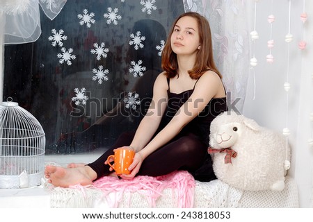 girl relaxed at home in winter holiday and enjoy a warm drink