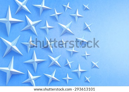 Blue stars on a blue background. Stars are made of paper
