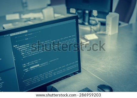 Web site codes on computer monitor at office