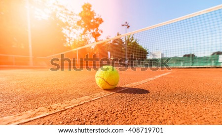 close-up tennis ball and net on court