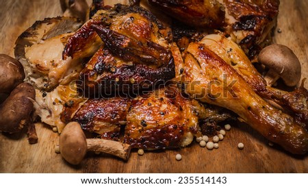 grilled healthy chicken cooked on a summer fresh herbs on a wooden board, close up view