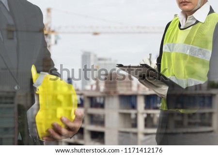 2 male occupational health and safety officer inside construction site doing inspection