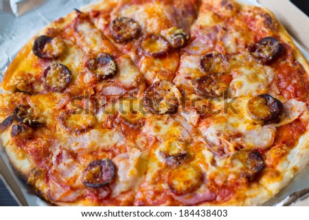 Sausages and bacon pizza- detail