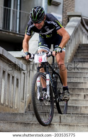 SLOVAKIA, RUZOMBEROK - MARCH 17 2012: Mountain bike competition on town stairs